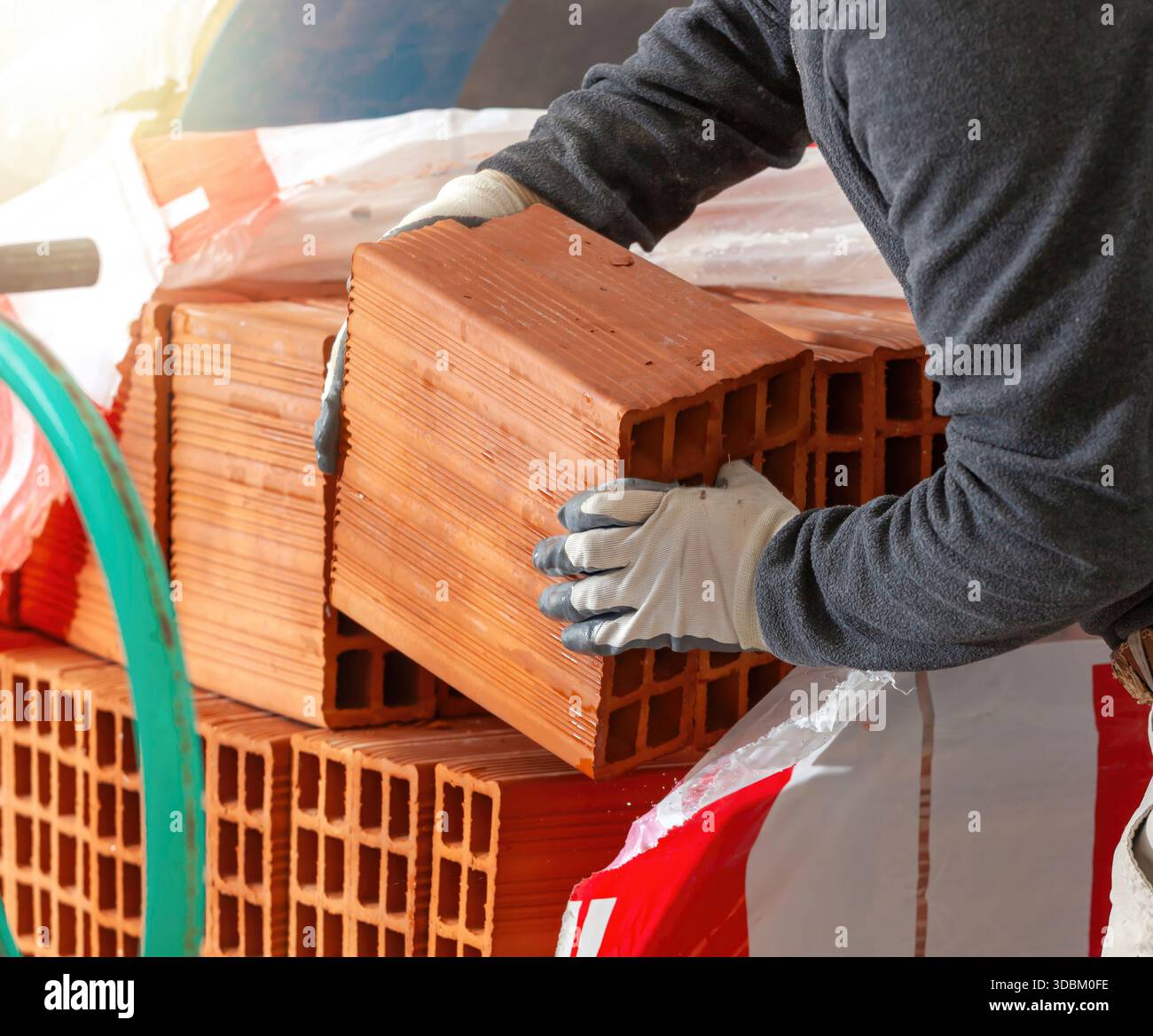 Construction worker carefully handling hi-res stock photography and ...