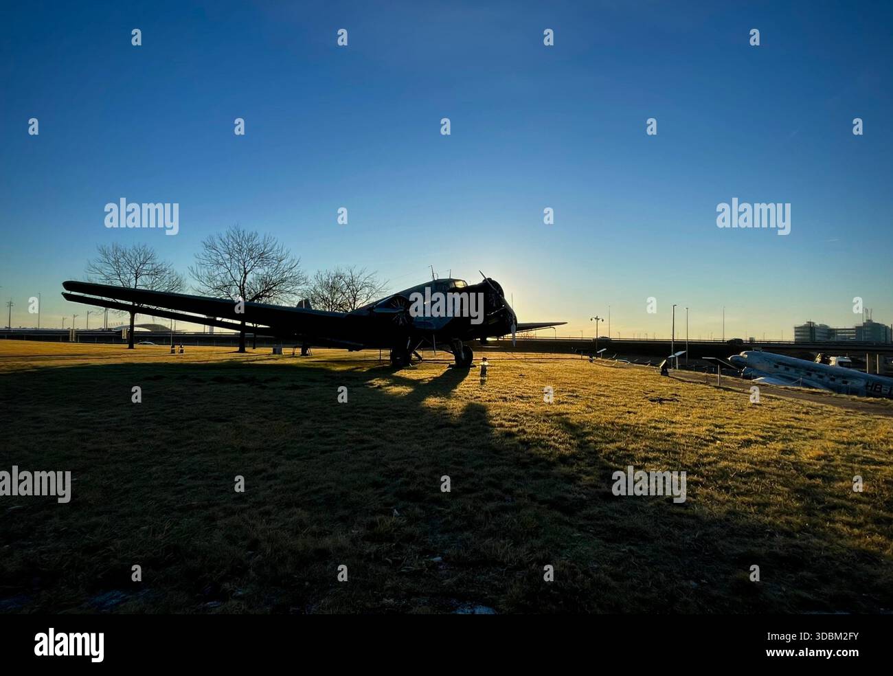 Historic Lufthansa aircraft displayed outdoors at Munich Airport Visitors Park during morning golden hour - Smartphone Captured Stock Image