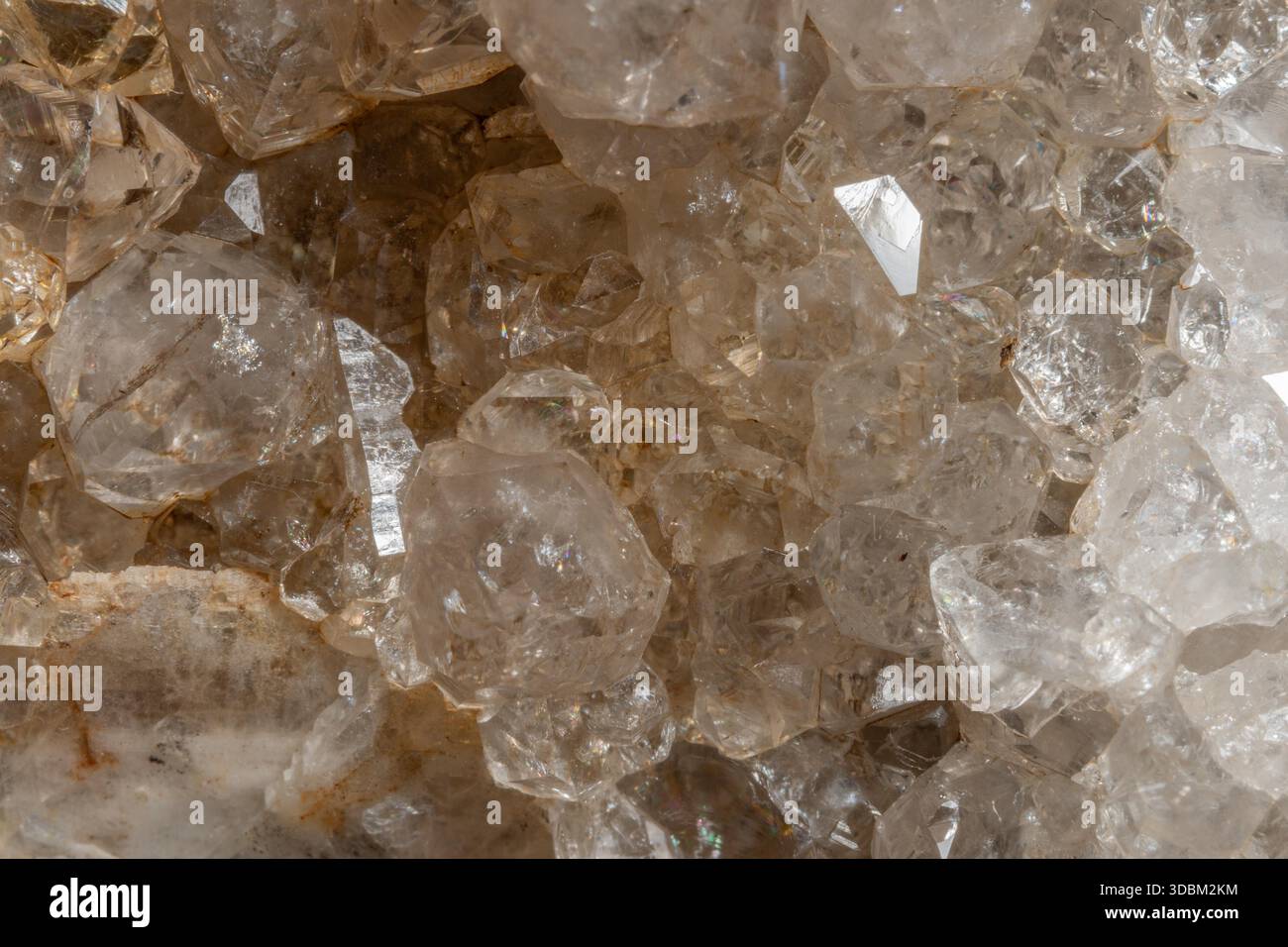Bright, angular crystals are visible on piece of rock. Light highlights ...