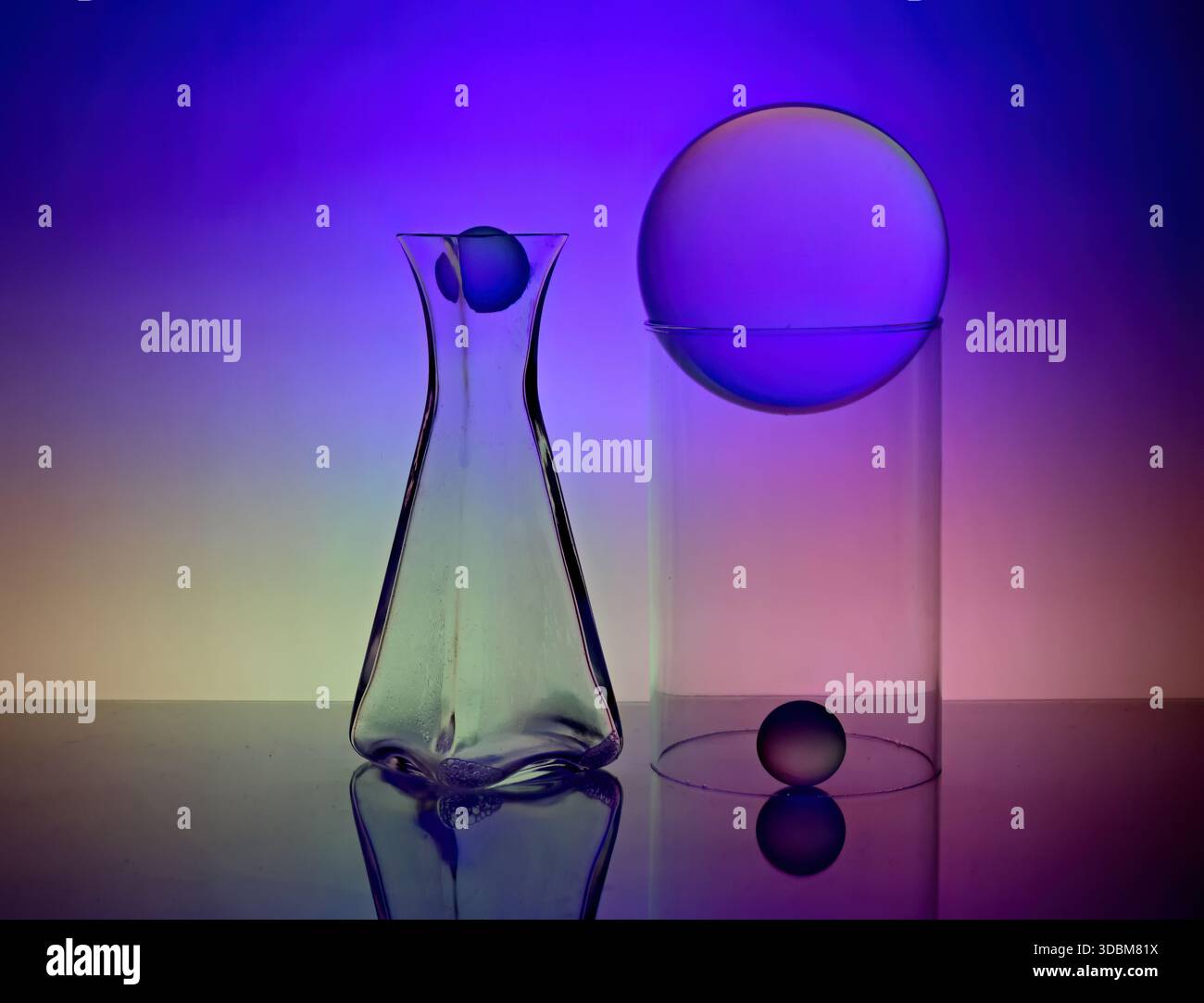 Glass items with colorful background lighting Stock Photo