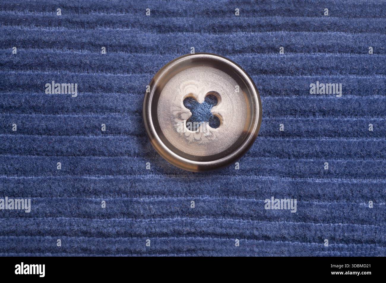 Close-up button on blue fabric Stock Photo