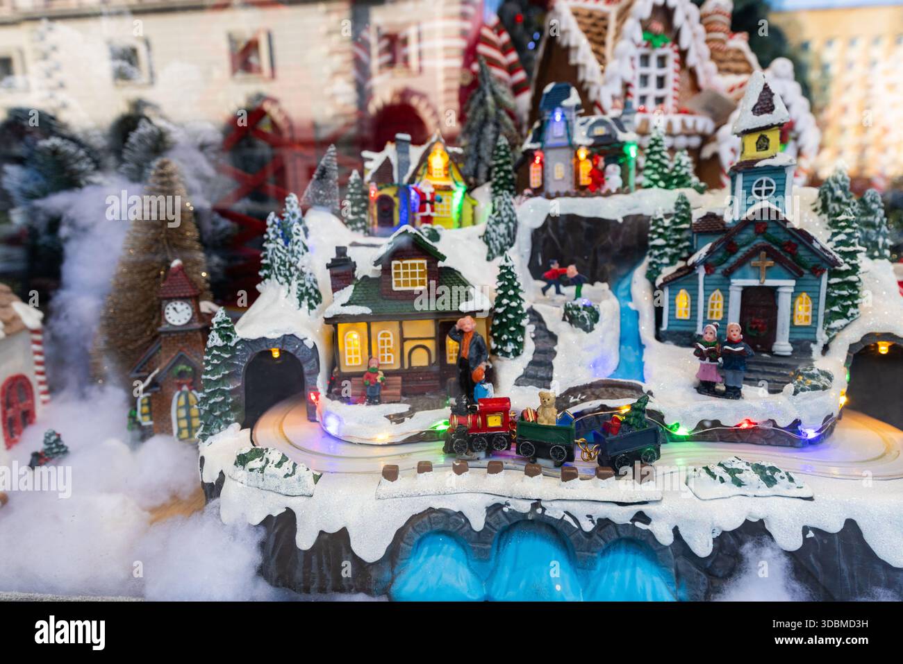 Miniature Christmas Village Train Set with Snowy Houses and Colorful ...