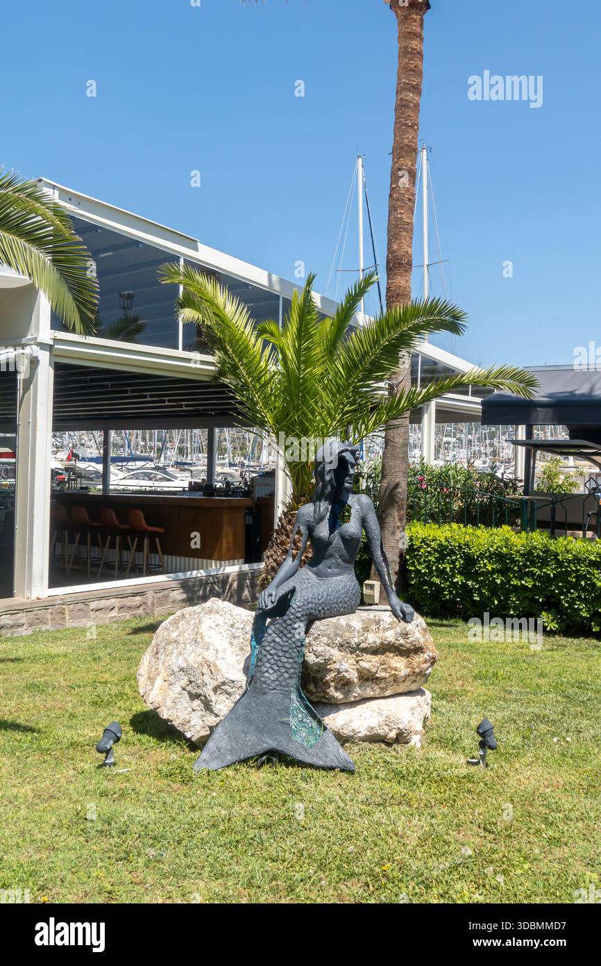 mermaid sculpture situated on a lawn in Bodrum Marina, Turkey Stock Photo