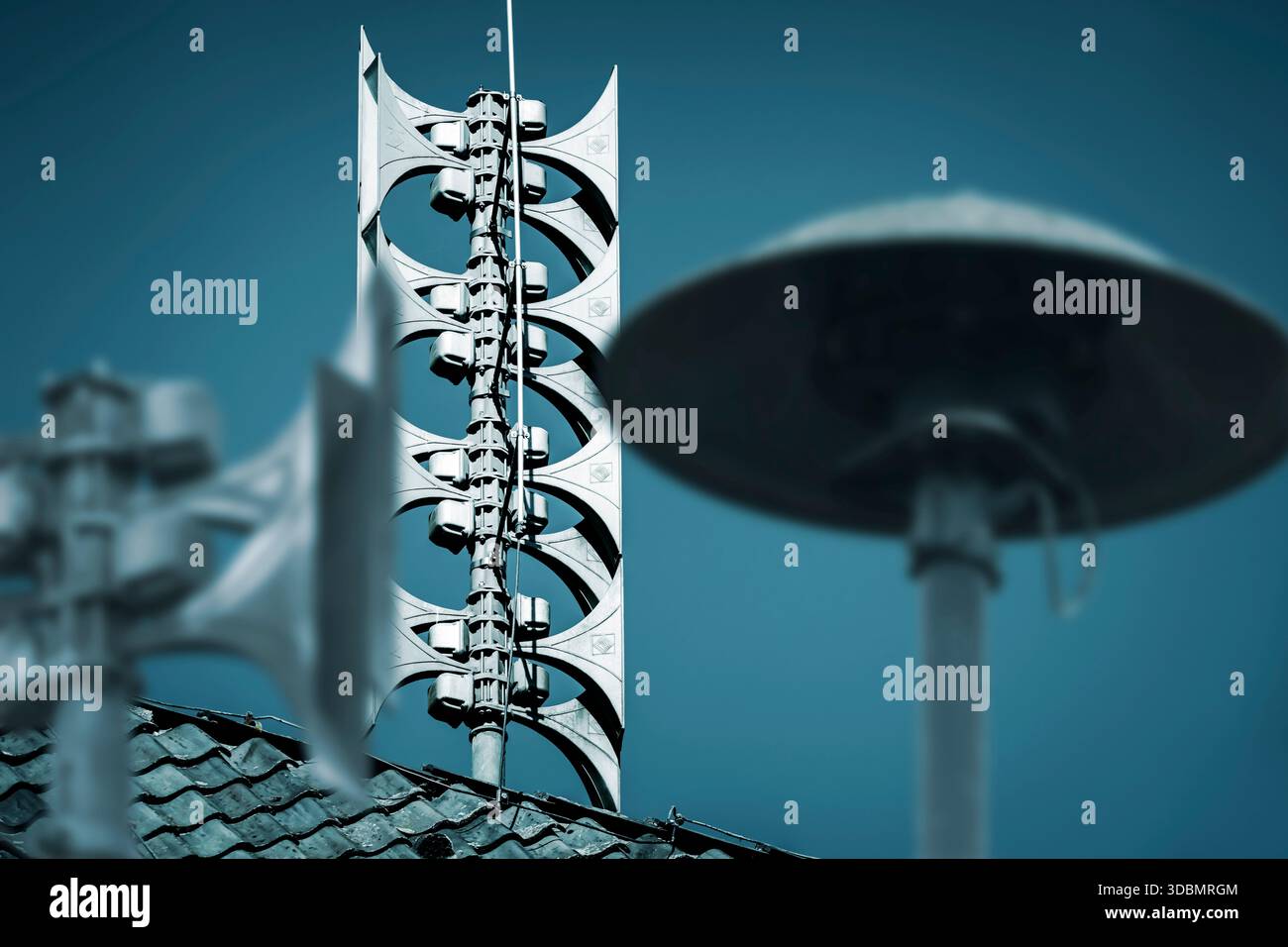 Electronic sirens and motorized sirens on roofs, photomontage Stock Photo