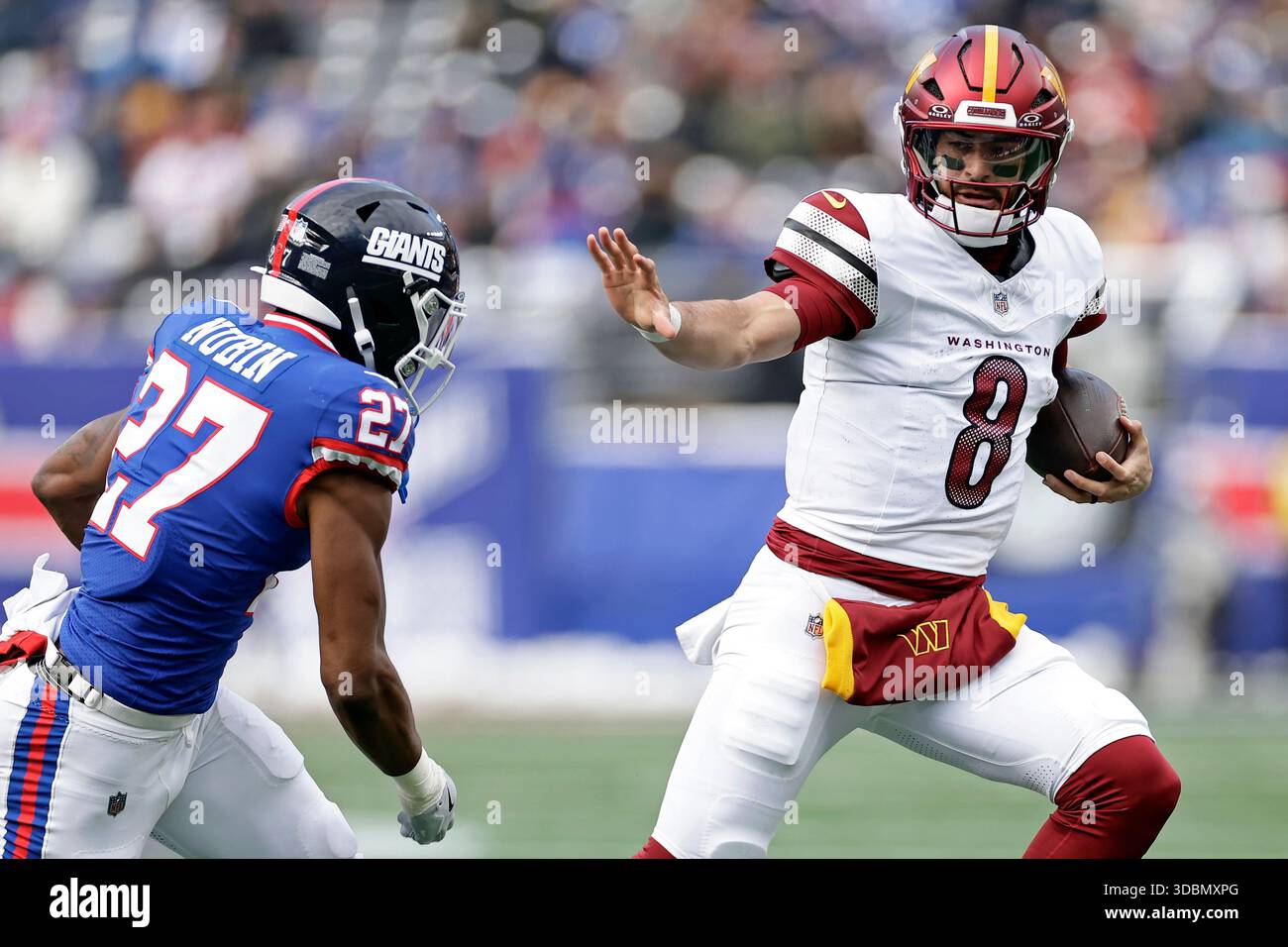 Washington Commanders quarterback Marcus Mariota (8) runs with the ball ...