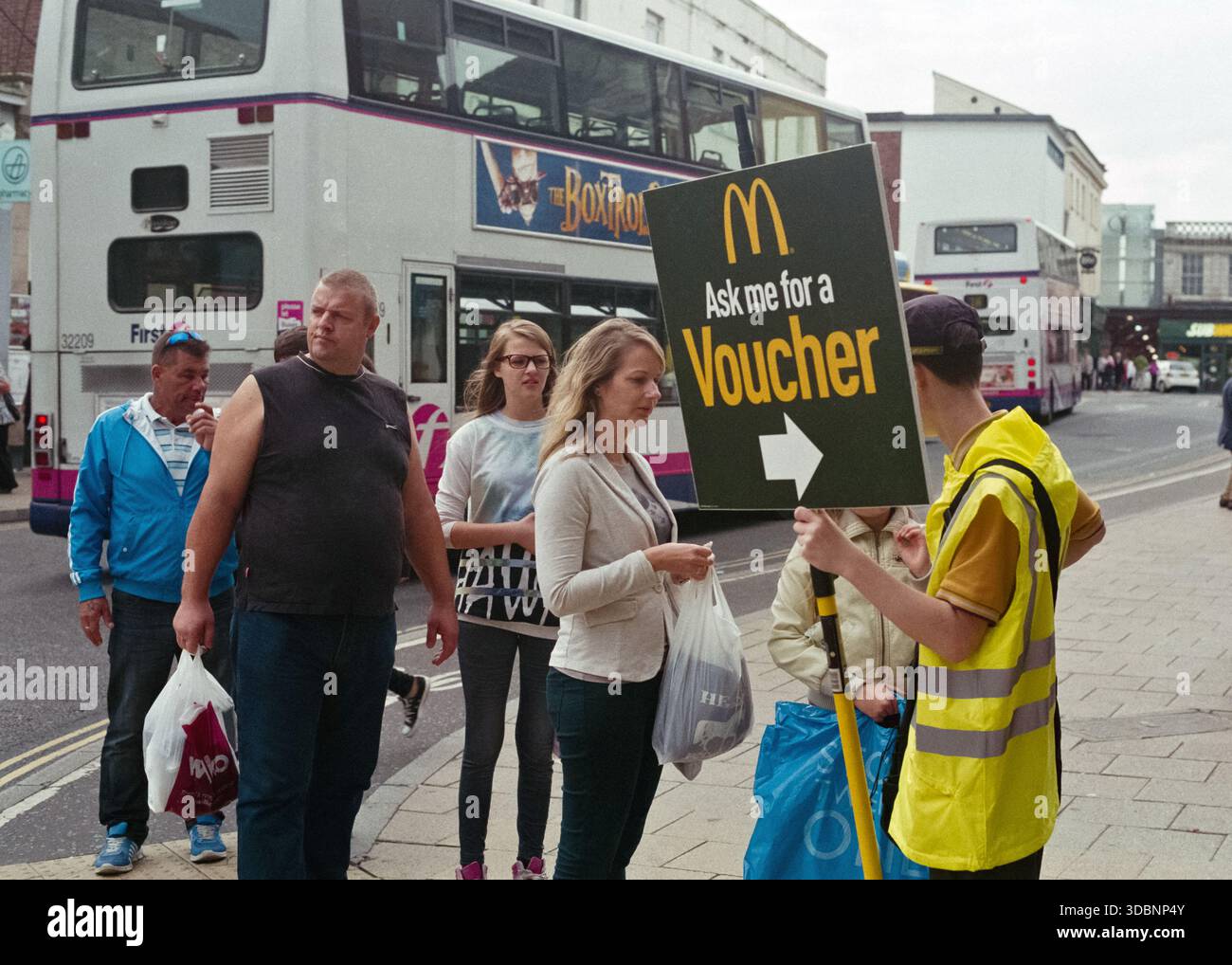 McDonald's employee giving out vouchers for a fast food promotion Stock ...