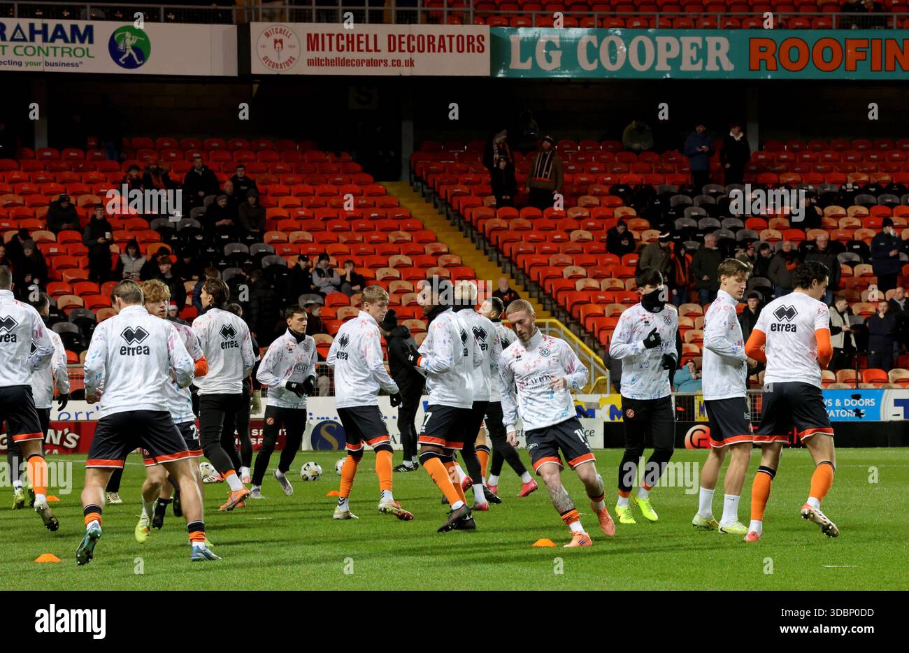 Dundee United players warm up before the William Hill Premiership match ...