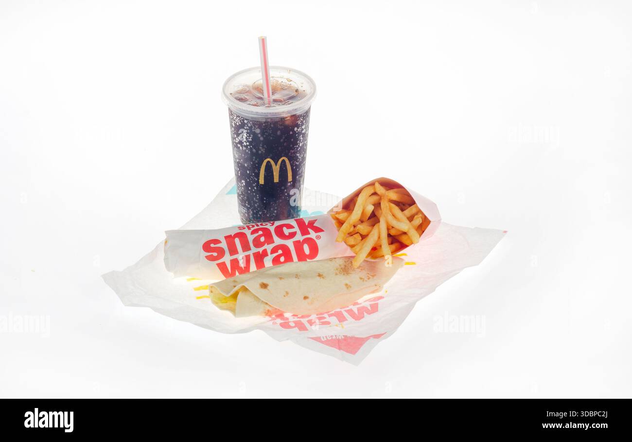 McDonald's Chicken snack wraps with large french fries on wrapper. 1 Ranch snack wrap unwrapped and 1 spicy wrapped. Isolated on white background. Stock Photo