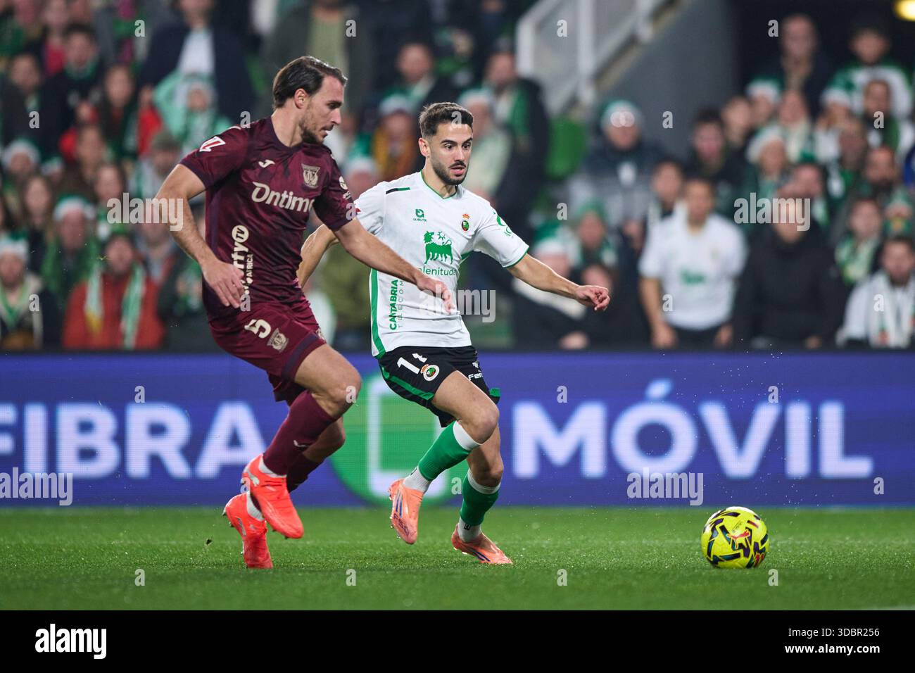 Andres Martin of Real Racing Club duels for the ball with Ignasi Miquel of CD Leganes during the LaLiga Hypermotion match between Real Racing Club and Stock Photo