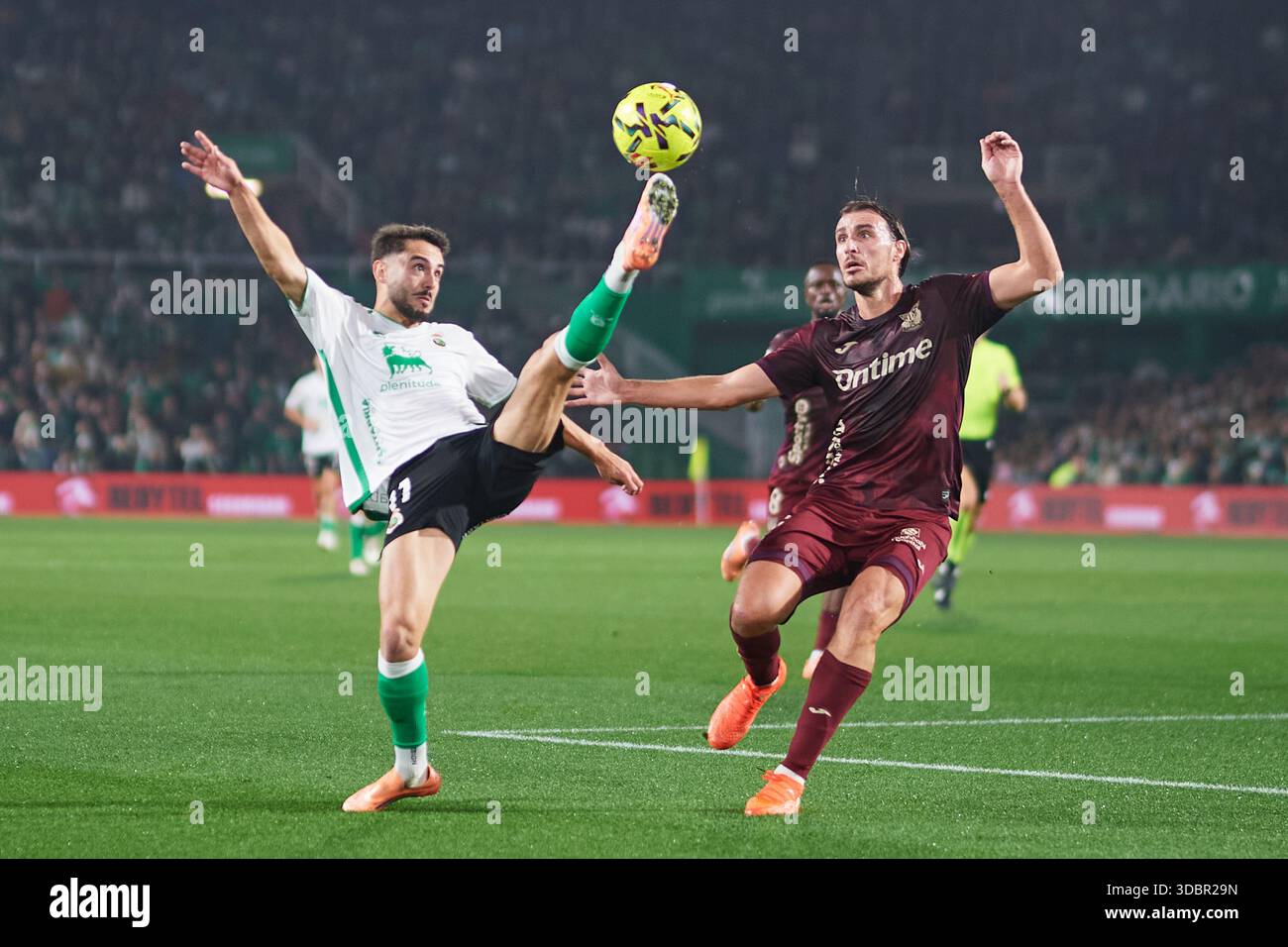 Andres Martin of Real Racing Club duels for the ball with Ignasi Miquel of CD Leganes during the LaLiga Hypermotion match between Real Racing Club and Stock Photo