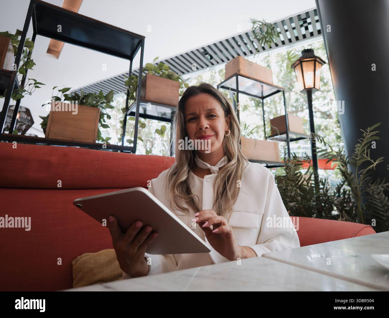 Seated professional woman in hi-res stock photography and images - Alamy