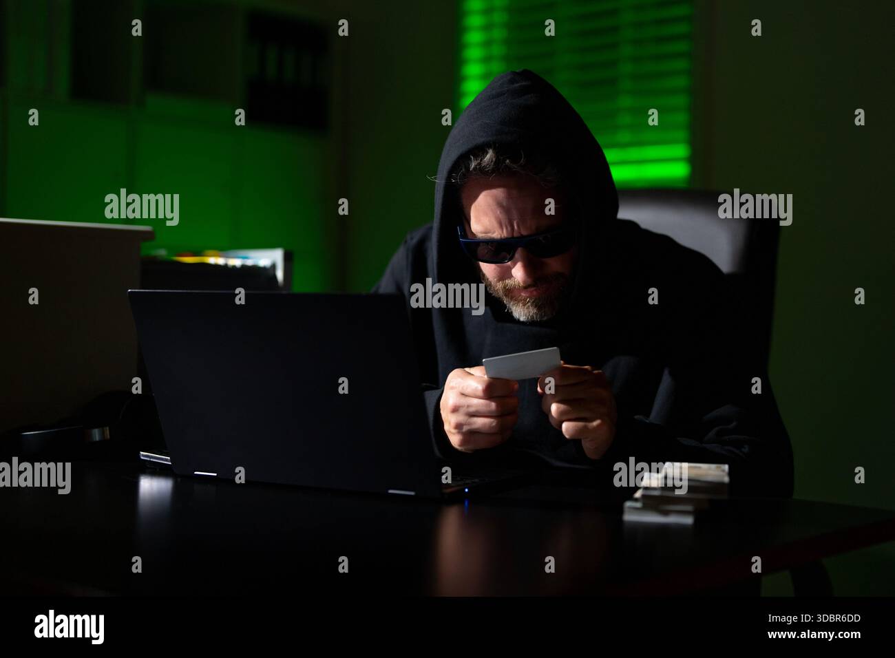 Crypto currency hacking. Hacking hunting for crypto currency. Cryptocurrency  hack. Hacker in hoodie dark night theme. Digital data security concept  Stock Photo - Alamy