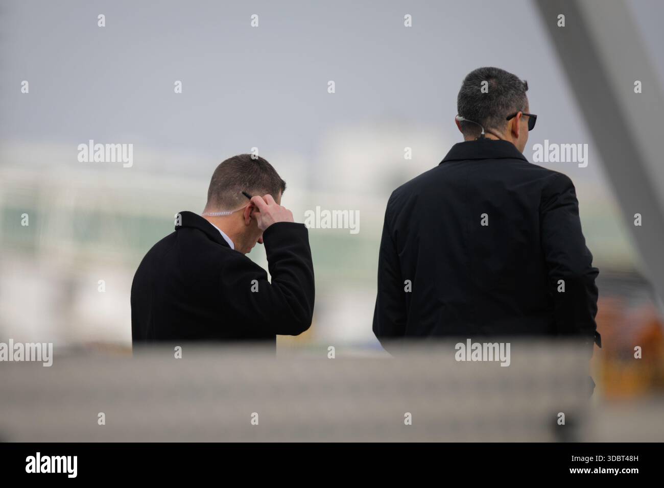 Otopeni, Romania - March 11, 2022: Otopeni, Romania - March 11, 2022: Secret Service agents during the visit of a United States dignitary. Stock Photo