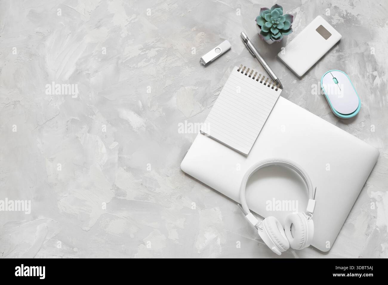Modern gadgets with notebook on grunge background Stock Photo
