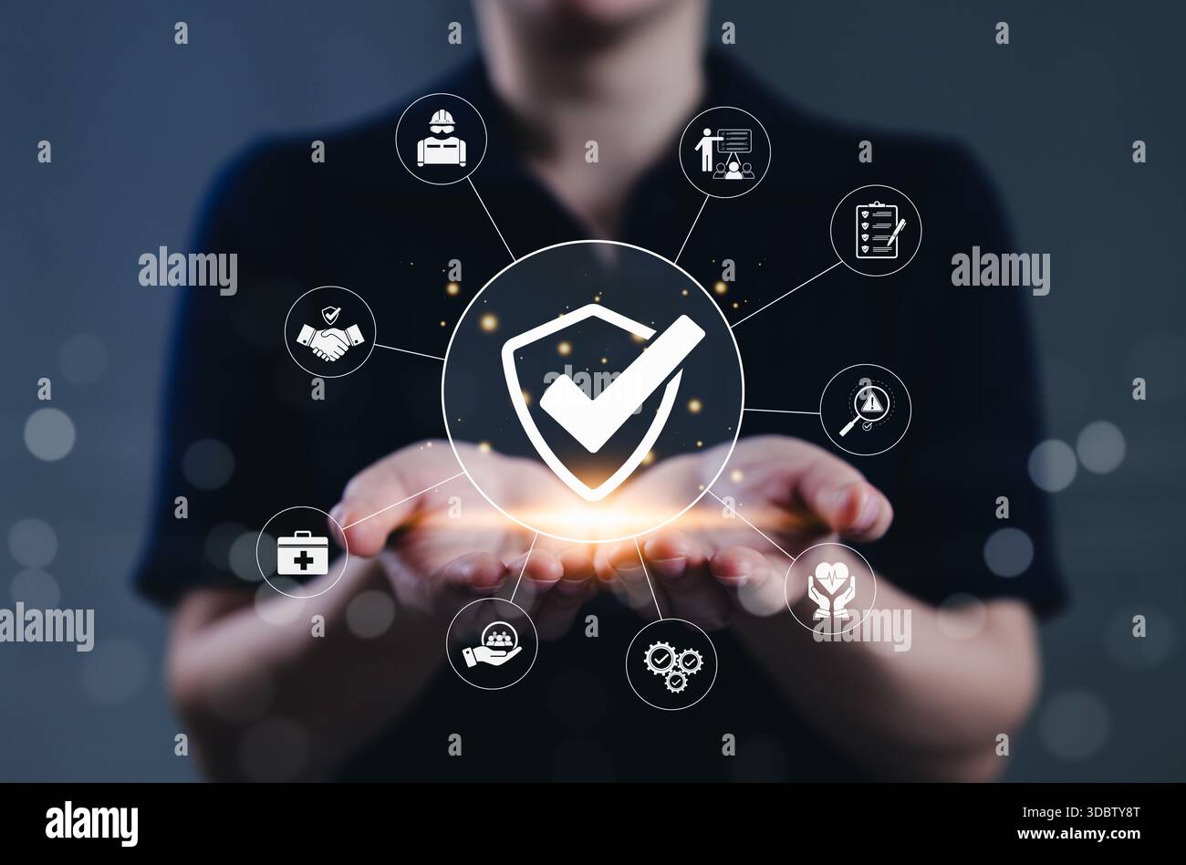 Shield And Risk Work safety and compliance management concept. A person holds a shield ...