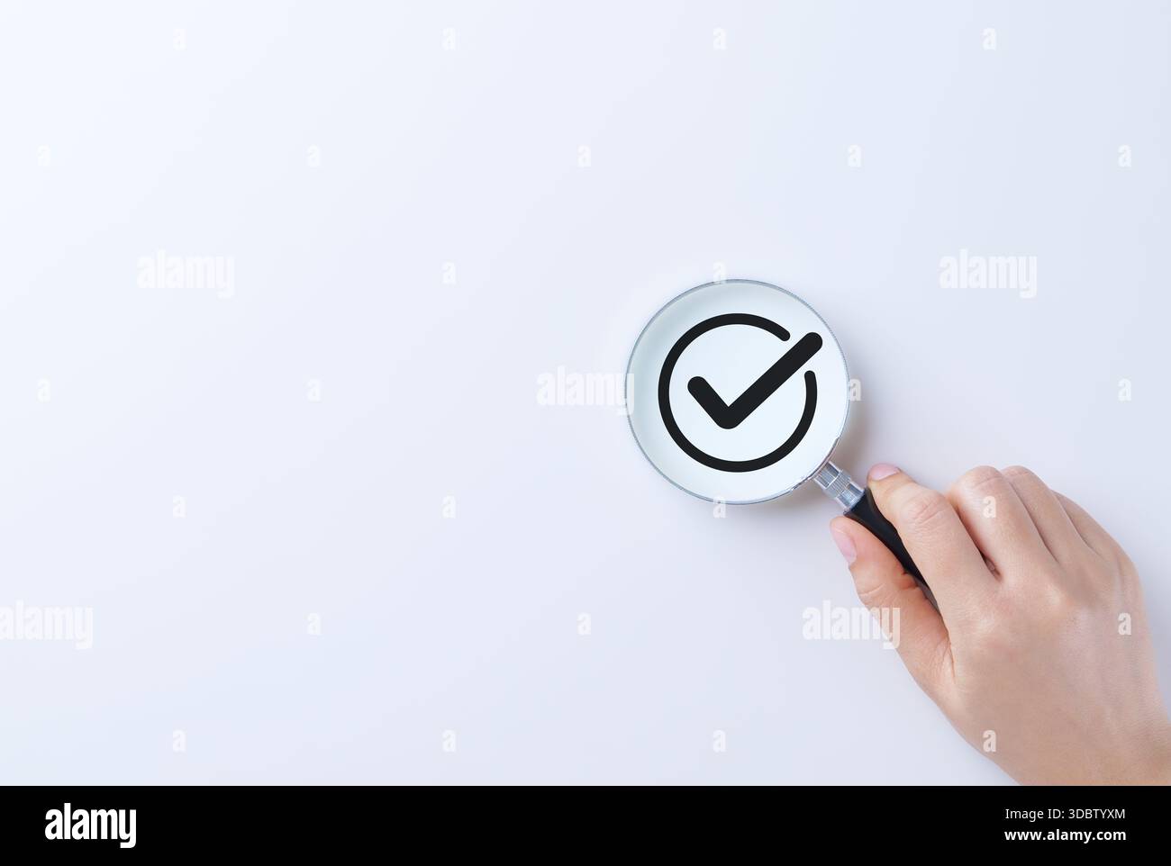 Verification and approval concept. A magnifying glass focusing on check ...