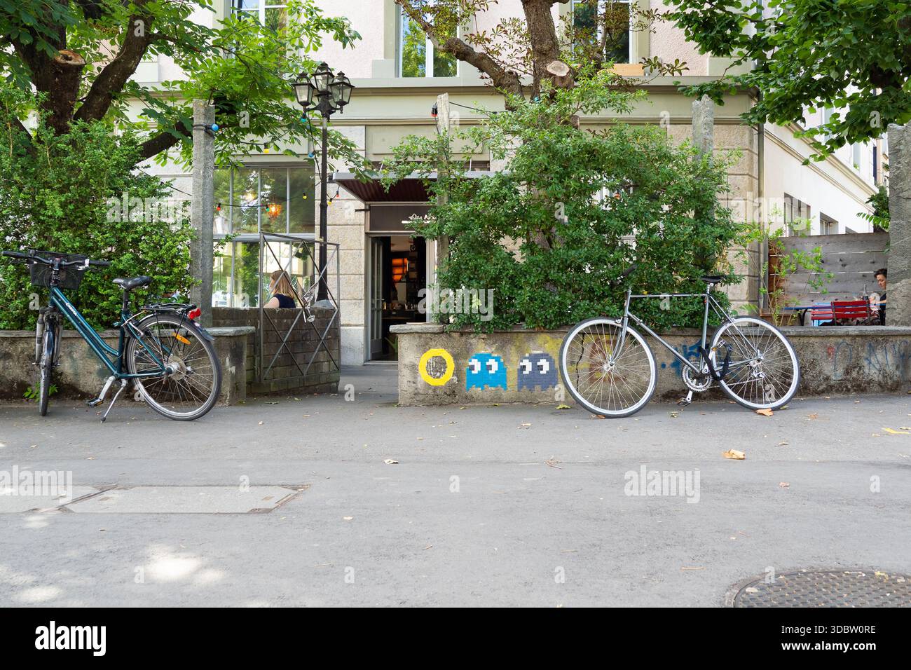 Bicycles Parked Outside a Bern Café with Space Invader Pixel Art on a ...