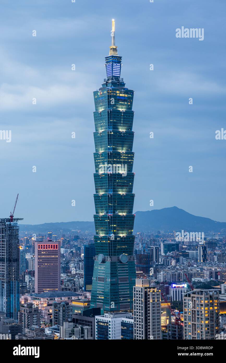 Aerial view of the iconic Taipei 101 skyscraper piercing the twilight ...