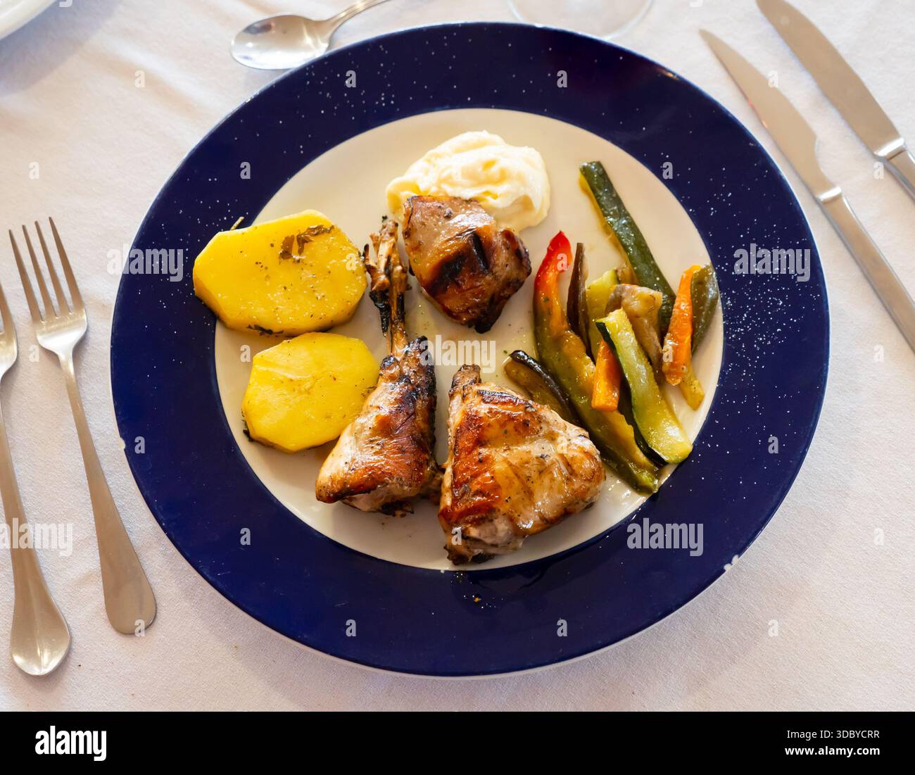 Roasted rabbit served with vegetable garnish Stock Photo