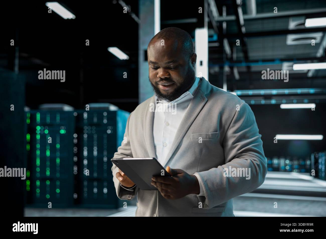 Server room IT professional doing infrastructure scans, fixing network issues affecting rigs performance. Data center programmer runs system diagnostic tests on tablet, tracking resource utilization Stock Photo