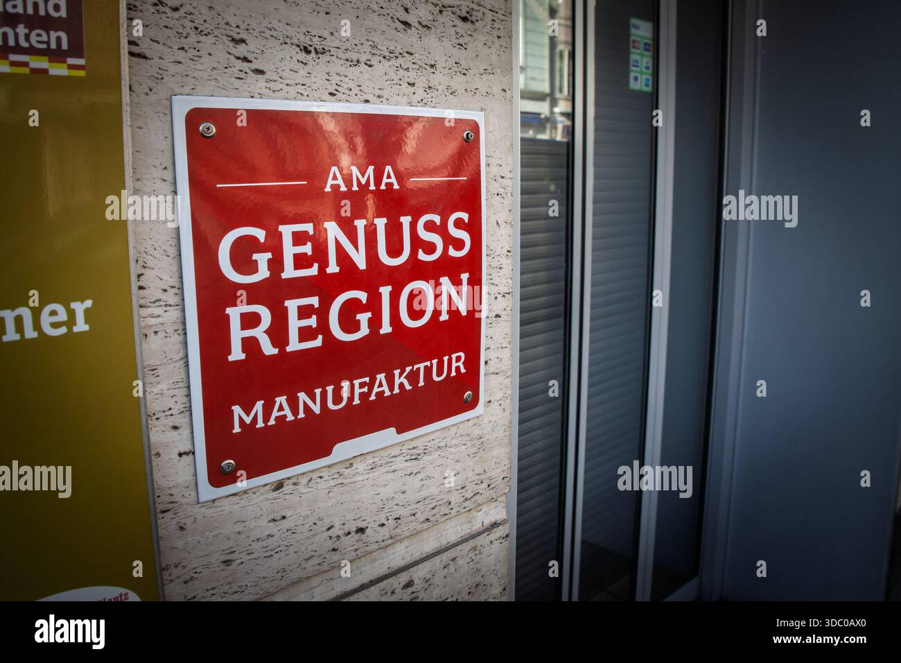 KLAGENFURT, AUSTRIA - DECEMBER 28, 2024: Sign of AMA Genuss Region on the exterior of a restaurant in Klagenfurt, highlighting Austrian regional quali Stock Photo