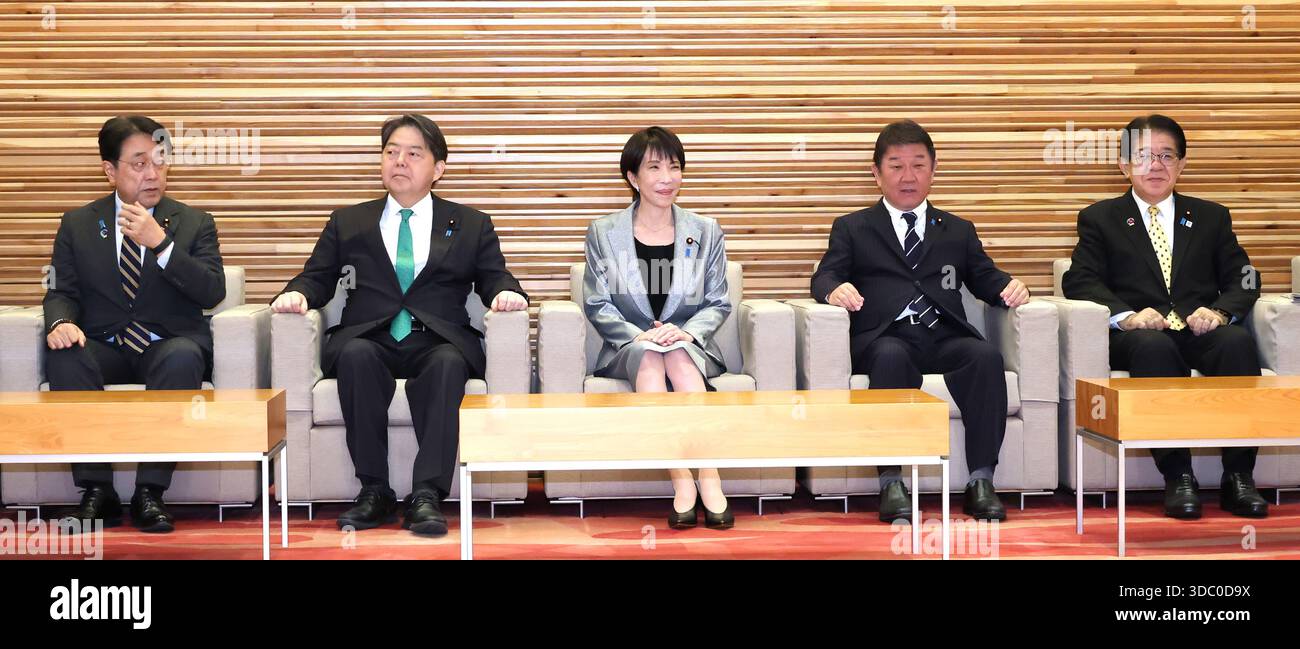 Japanese Prime Minister Sanae Takaichi (C) attends a cabinet meeting at ...