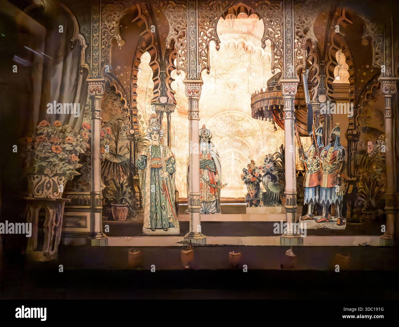 Elaborate miniature theatre diorama stage scene with historical costumes and ornate architecture set in a detailed dramatic presentation - Smartphone Captured Stock Image