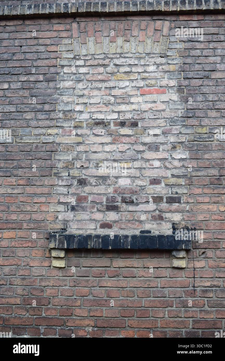 closed window in a brick wall Stock Photo