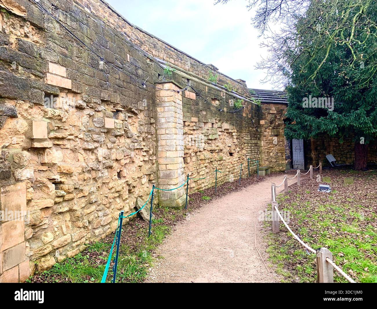 Lincoln Castle and its medieval stone towers with Lincolnshire Cathedral rising behind viewed  across the historic grounds in Lincoln Lincolnshire - Smartphone Captured Stock Image