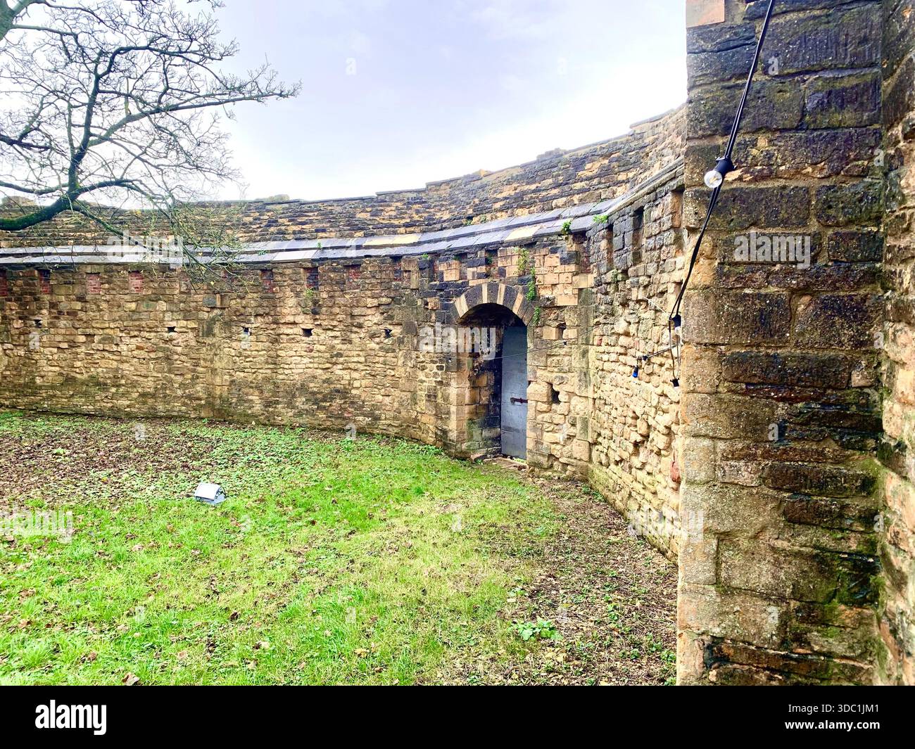 Lincoln Castle and its medieval stone towers with Lincolnshire Cathedral rising behind viewed  across the historic grounds in Lincoln Lincolnshire - Smartphone Captured Stock Image