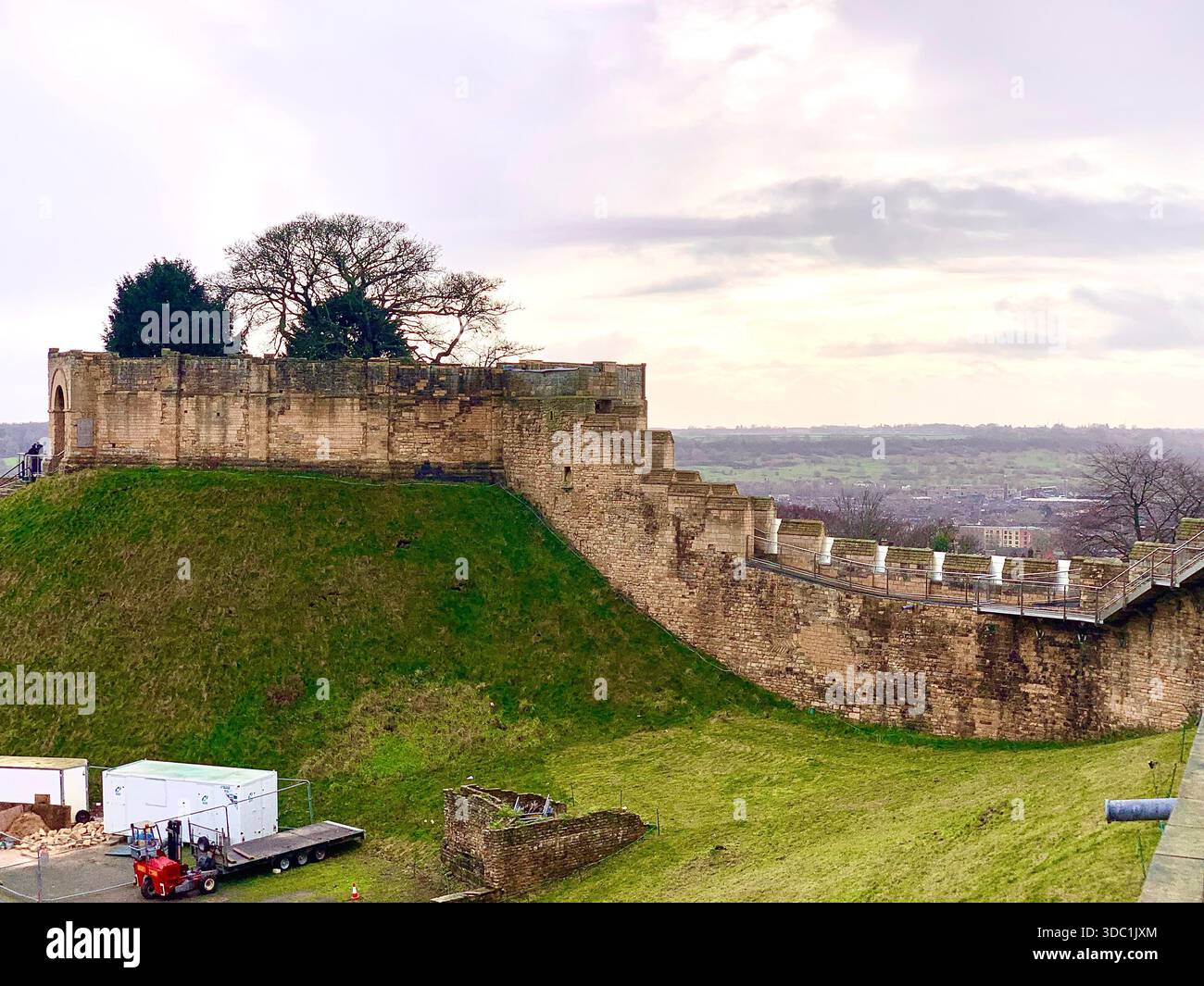 Lincoln Castle and its medieval stone towers with Lincolnshire Cathedral rising behind viewed  across the historic grounds in Lincoln Lincolnshire - Smartphone Captured Stock Image