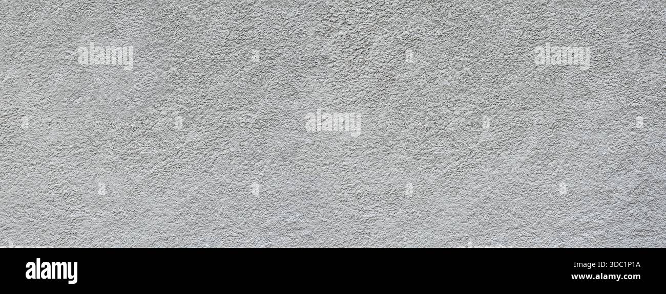 Grey textured concrete wall surface providing a rough abstract background Stock Photo