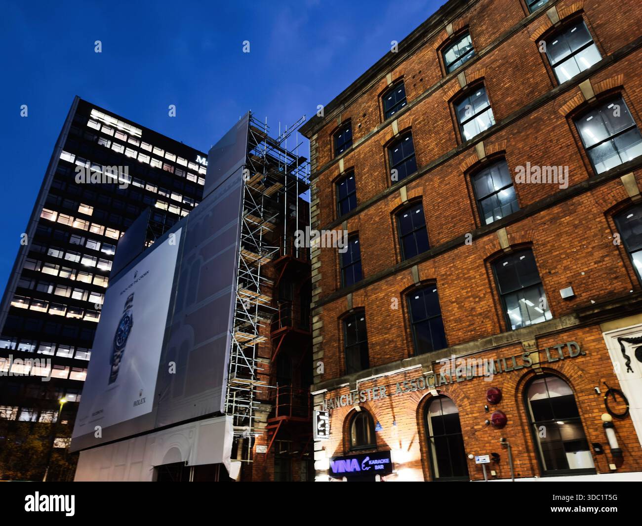 Manchester, UK - December 10, 2025: Nighttime city street in Manchester ...