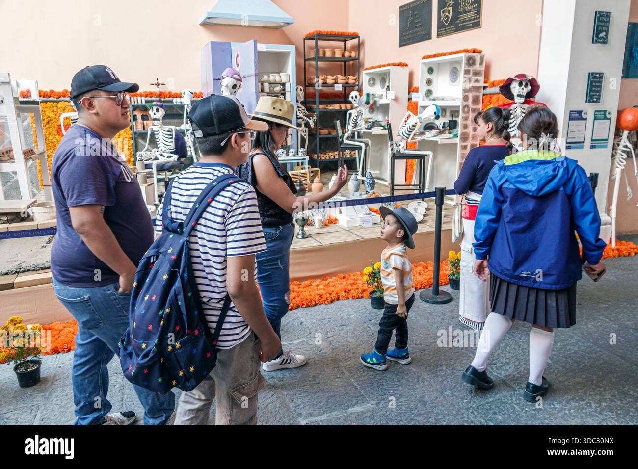 Puebla Mexico,Day of the Dead exhibit,Dia de Muertos Day of the Dead,skeleton figures,interactive display,handcrafted ceramics,folk art,marigold flowe Stock Photo