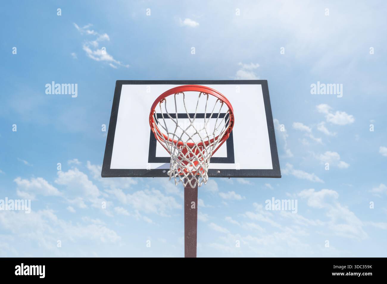 Basketball basket on blue sky background Stock Photo