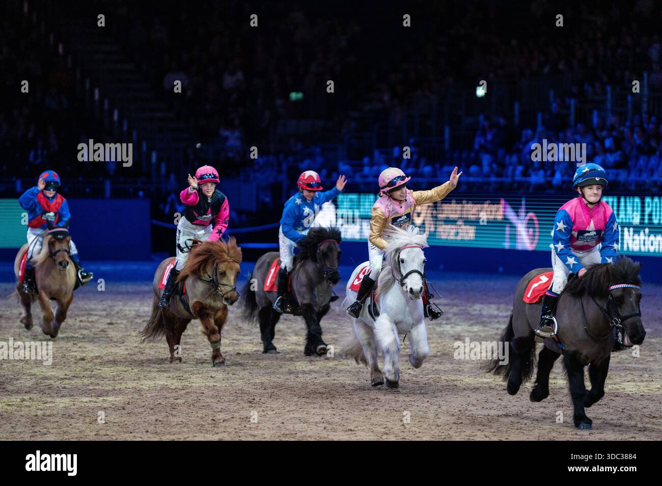 Children riding ponies during the shetland pony grand national in the ...