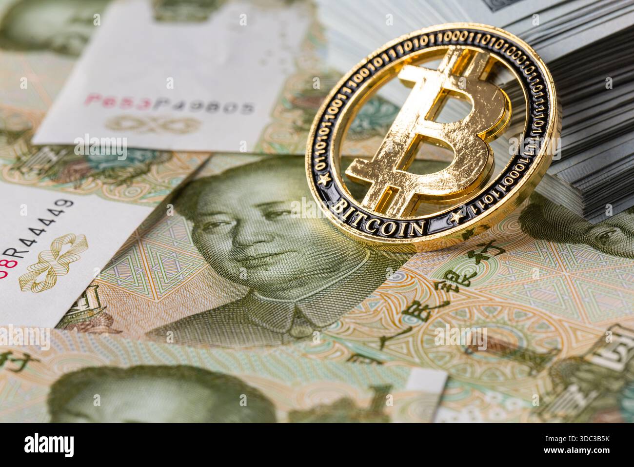 Physical Bitcoin Coin on Chinese Yuan with Stack of US Dollar Banknotes  Stock Photo - Alamy