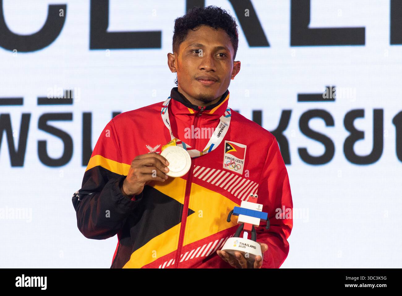 Elisio Raimundo Gaio of Timor-Leste poses for a photo with Silver medal ...