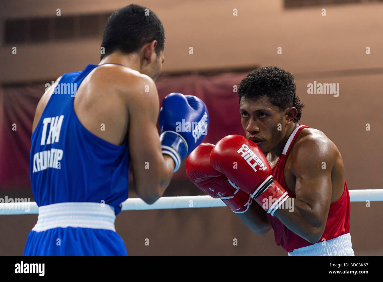 Khunatip Pidnuch (Blue) of Thailand and Elisio Raimundo Gaio (Red) of ...