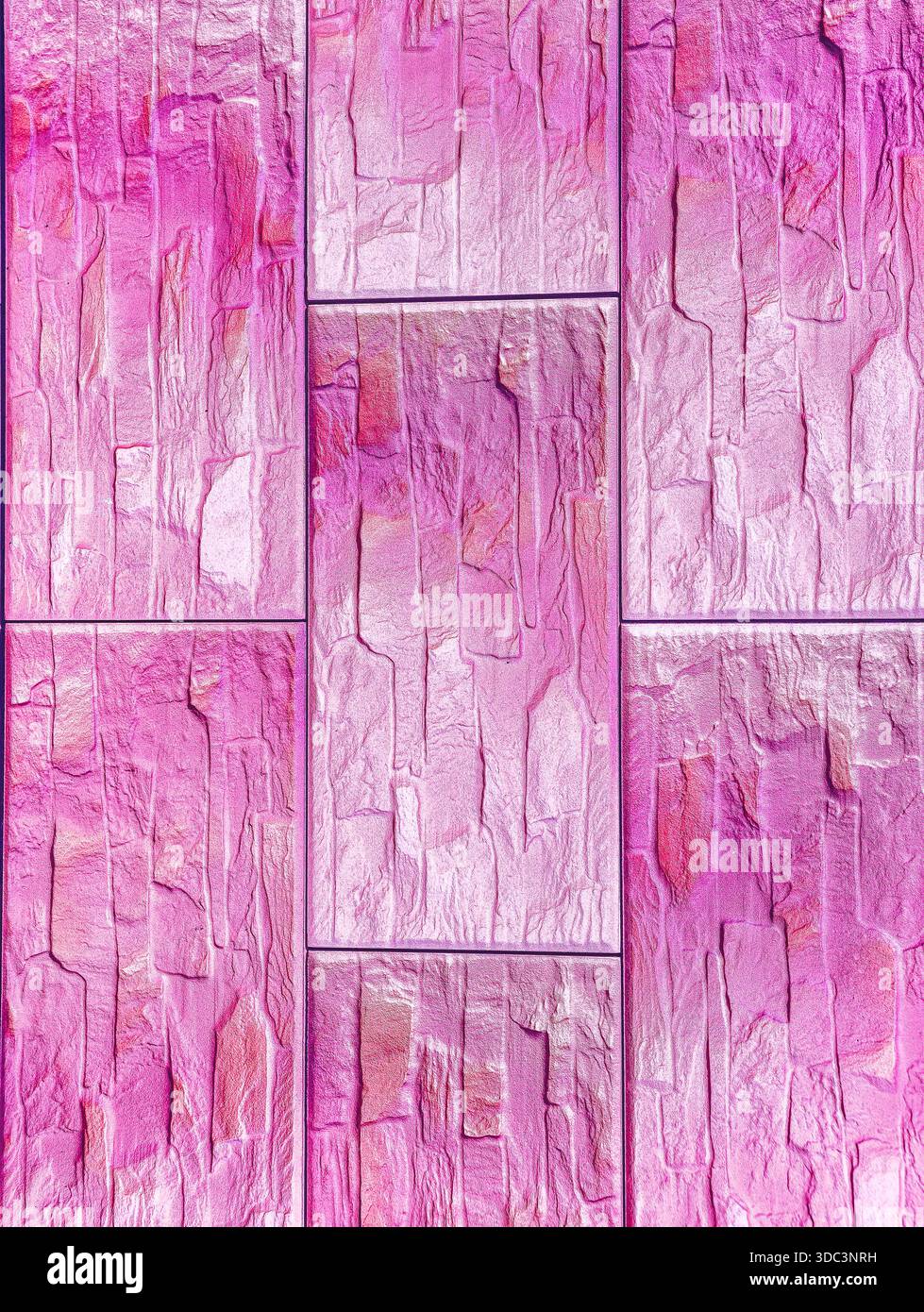 Pink Textured Stone Wall with Geometric Rectangular Blocks Pattern for Modern Design Projects Copy Space Background Stock Photo
