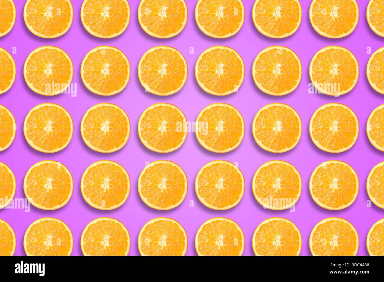Citrus fruit pattern. Sliced oranges on violet background Stock Photo