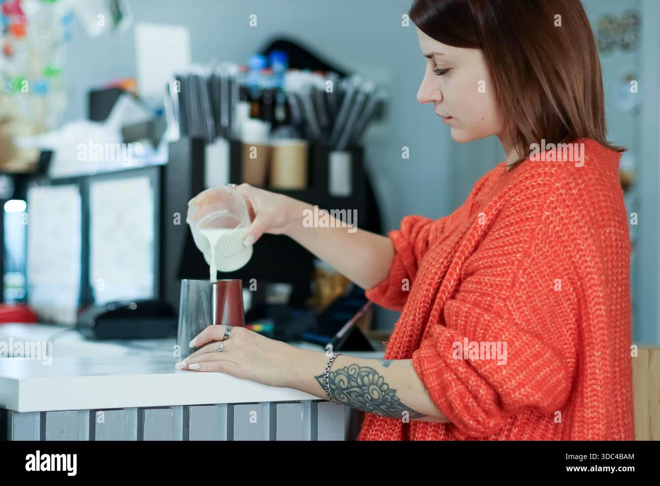 a waitress pours coffee into mugs and calculates remaining fluid ounces