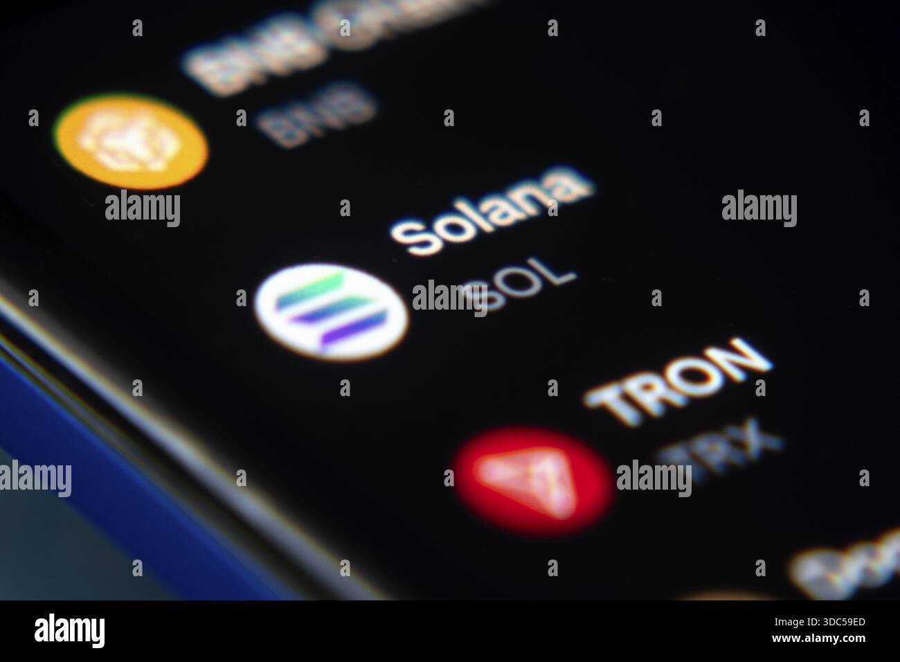 Solana and TRON displayed on a cryptocurrency app screen Stock Photo - Alamy