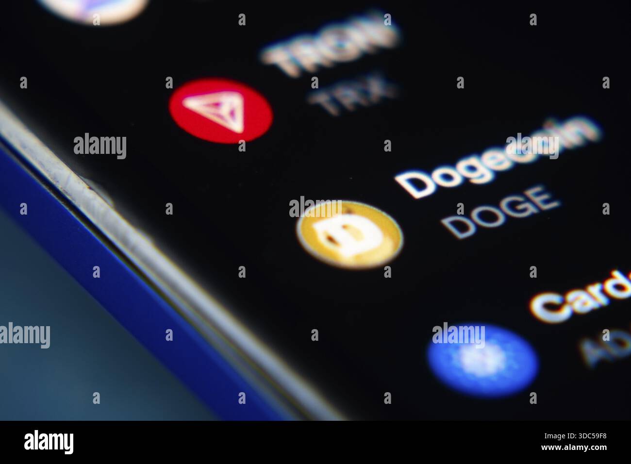 Dogecoin and TRON highlighted in a smartphone cryptocurrency app Stock  Photo - Alamy