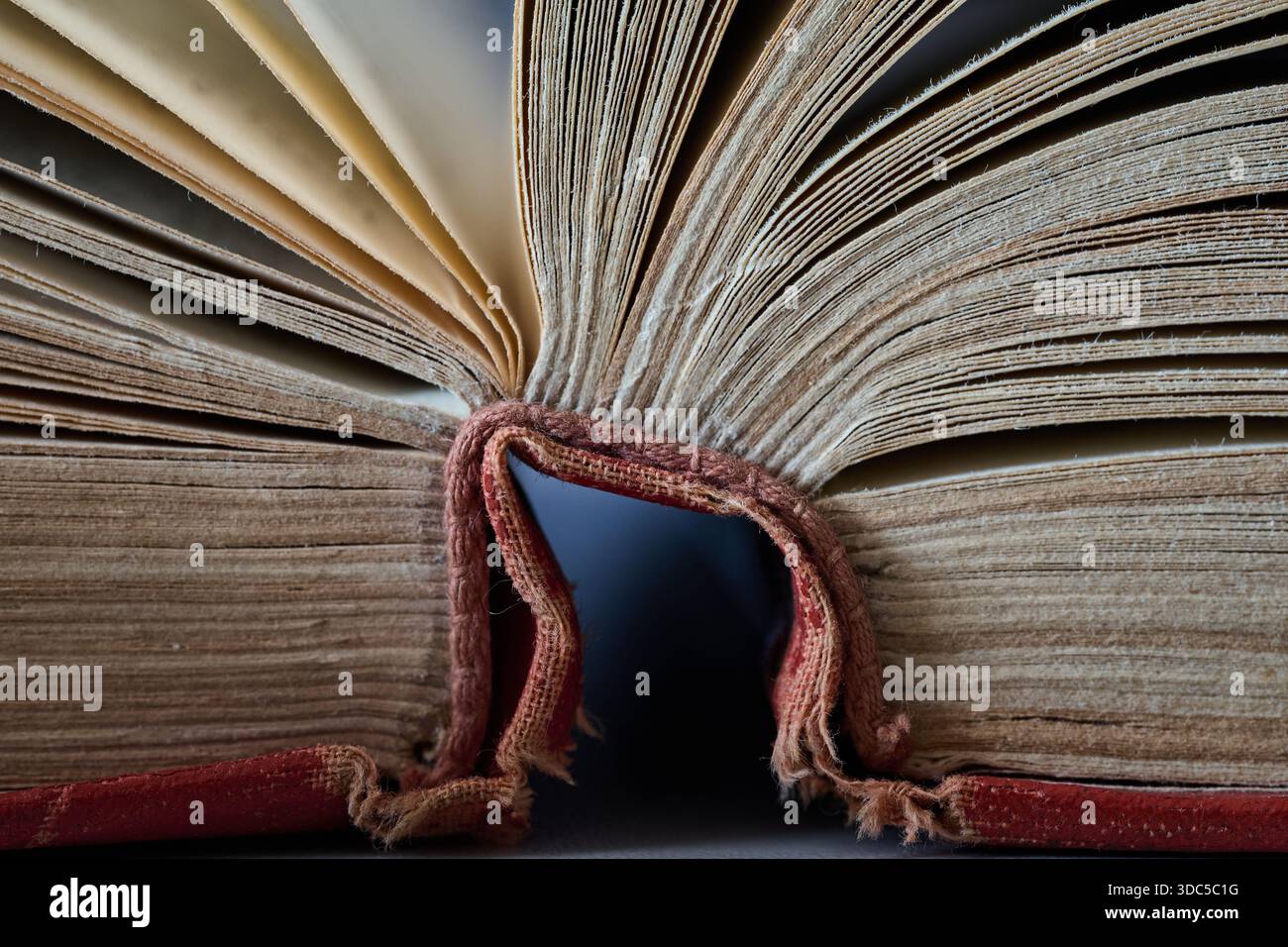 The open book reveals its pages and worn binding structure Stock Photo ...