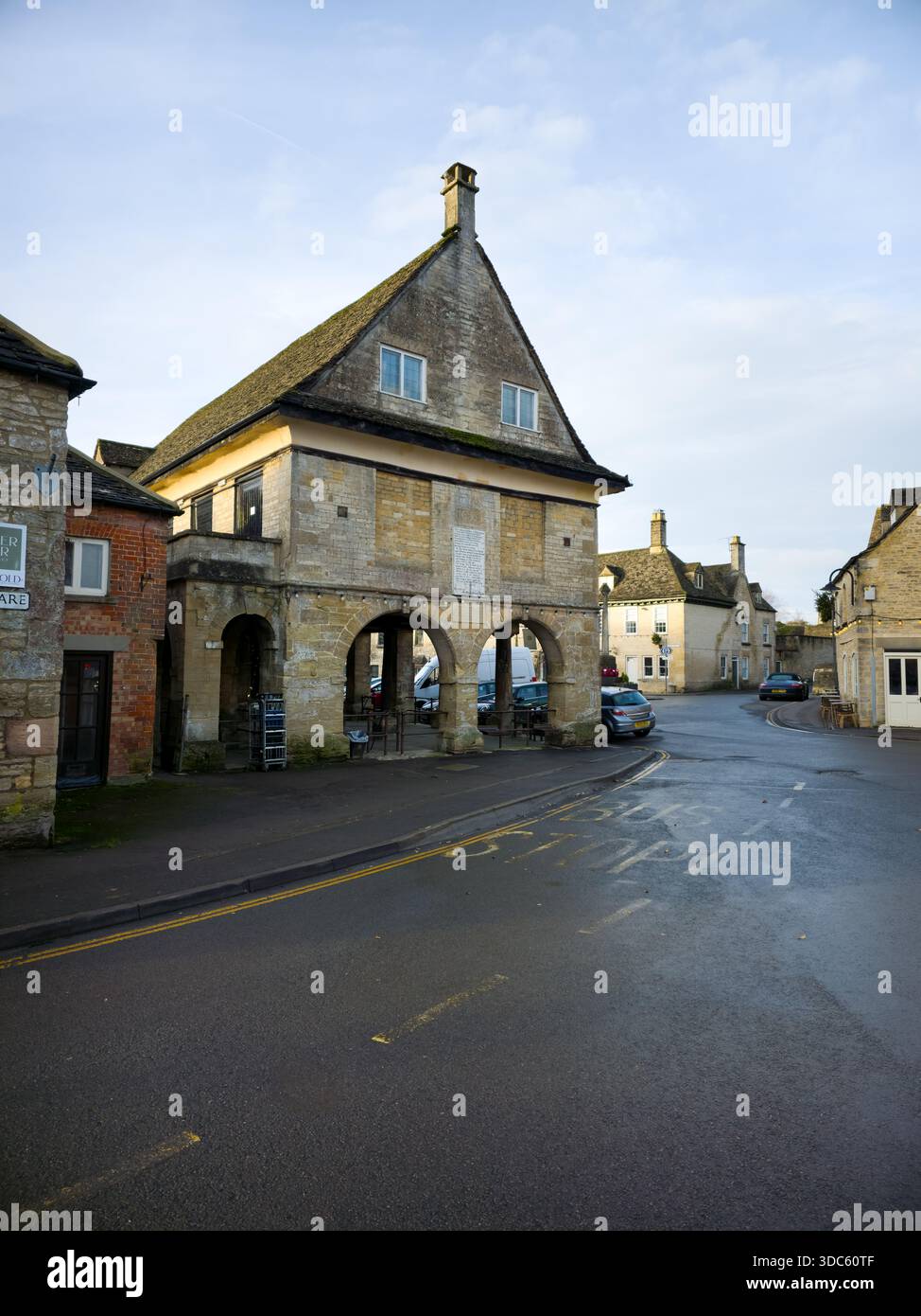 Quiet Village Street with Traditional Stone Shops, Cotswolds, England - Smartphone Captured Stock Image