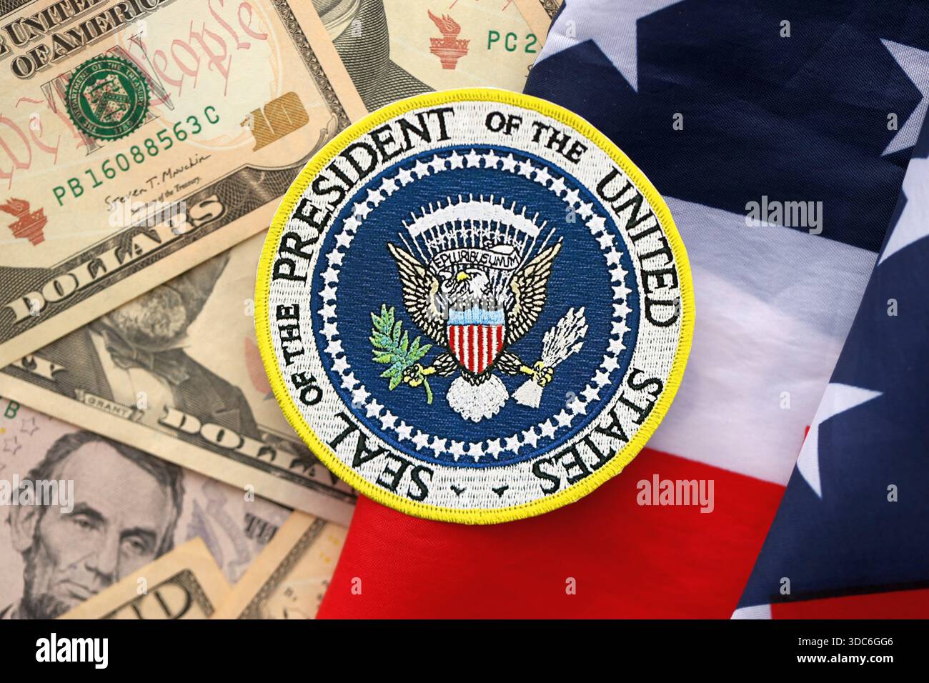 KYIV, UKRAINE - DECEMBER 13, 2025 Seal of the President of the United  States sticker on big amount of US dollar money bills banknotes and United  States flag close up Stock Photo - Alamy