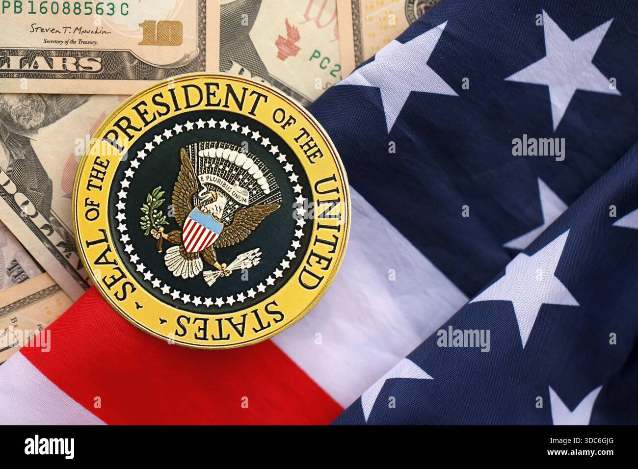KYIV, UKRAINE - DECEMBER 13, 2025 Seal of the President of the United  States sticker on big amount of US dollar money bills banknotes and United  States flag close up Stock Photo - Alamy