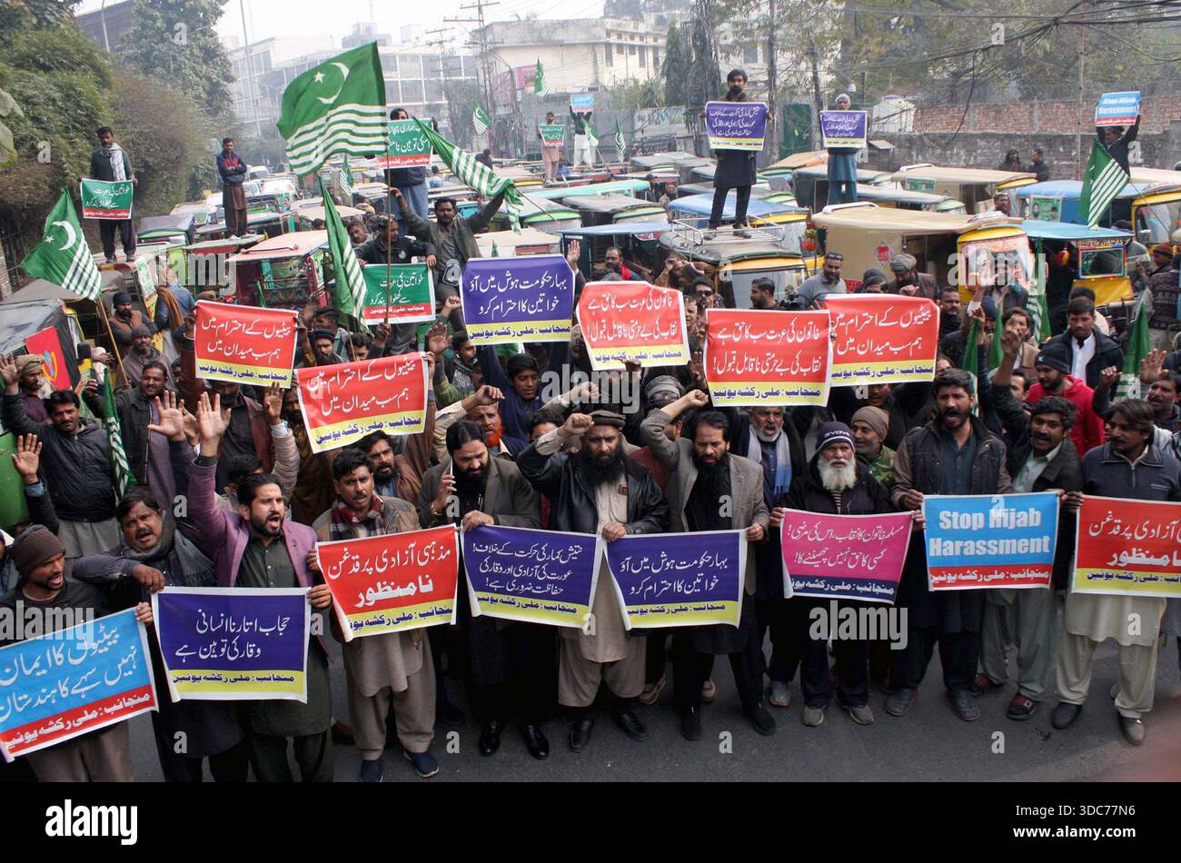 LAHORE, PAKISTAN, DEC 20: Members of Milli Rickshaw Union are holding ...