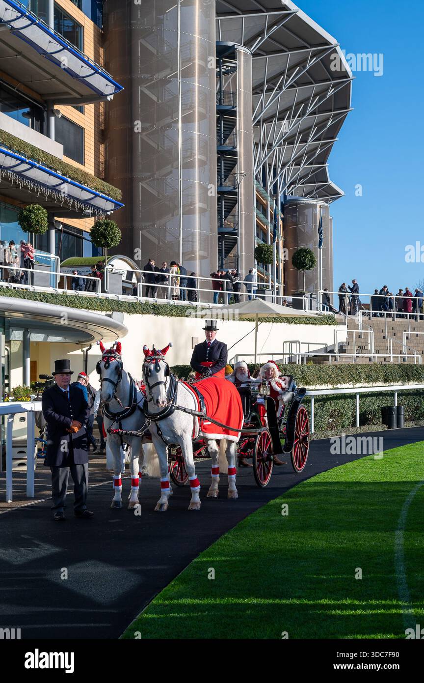 Santa Claus and Mrs Claus arrive in a horse drawn carriage at Ascot ...